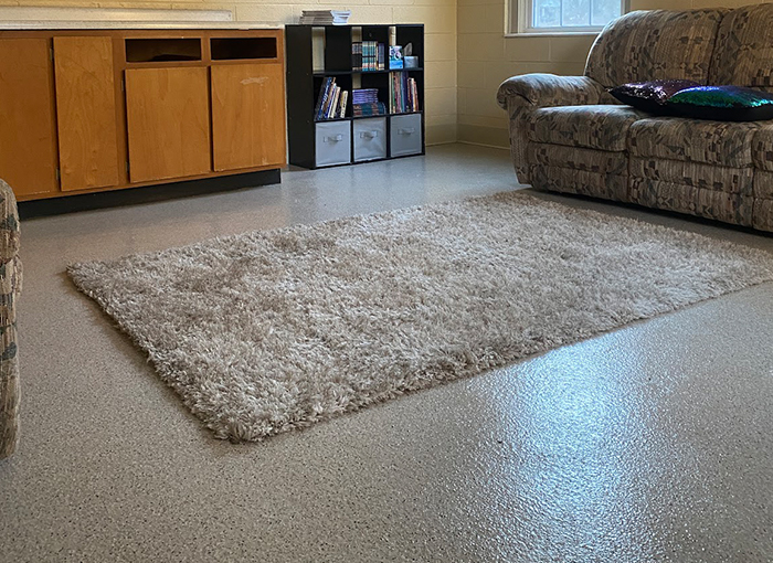 Coated flooring system applied in enclosed residential space