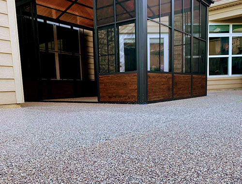 Residential patio with coated flooring surface